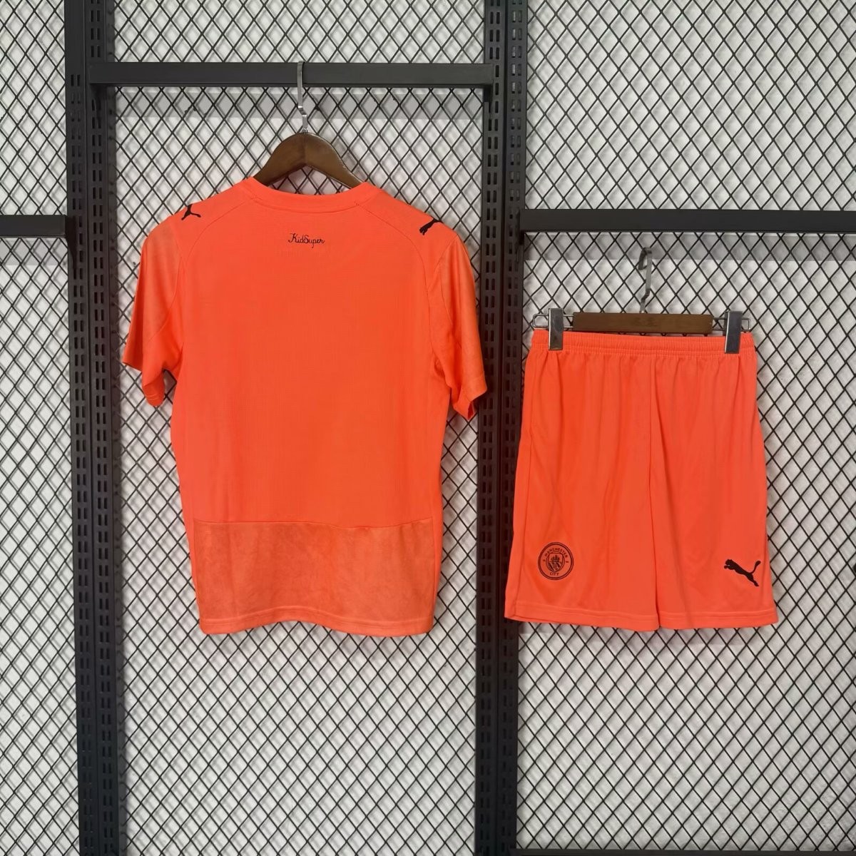 25 26 kids kidsuper x manchester city orange jersey back 25 26 Kids KIDSUPER x MANCHESTER CITY Orange Jersey - Back
